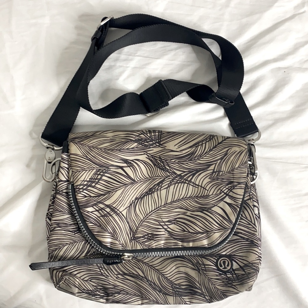 Lululemon cross body bag. Worn and used. In good physical condition.
